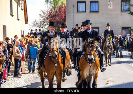 Sorbian Easter riders and spectators taking part in the Easter procession in Radibor near Bautzen, Germany. Stock Photo