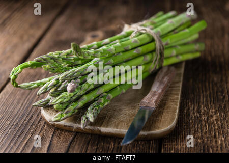 Green Asparagus (fresh harvested) on an old wooden table (selective focus) Stock Photo