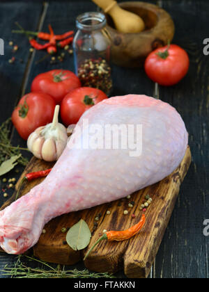 Fresh turkey drumstick on a wooden board Stock Photo