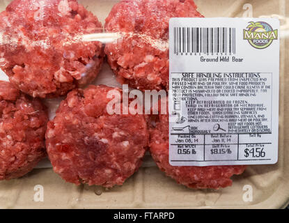 Ground wild boar meat unique local food for sale at grocery store, Maui, Hawaii Stock Photo