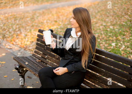 View of the woman holding a mug with coffee Stock Photo