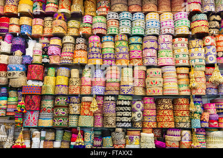 Display of colourful Asian and Oriental fabric trims, embroidery  and patterned edging Stock Photo