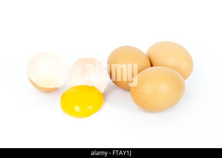 Egg in group broken on white background. This picture about food, breakfast or lunch and farm content. Selective focus at yolk. Stock Photo