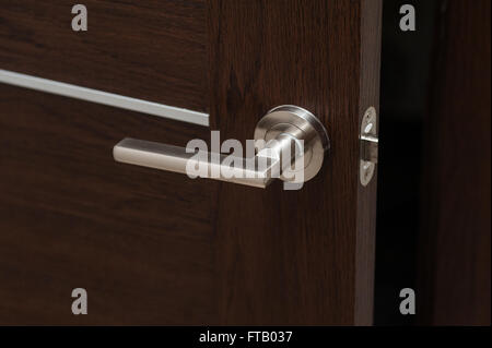 Modern metal door handle in living room Stock Photo