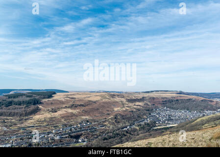 The village of Ferndale from the hills above the valley, and the wind turbines on the opposite hill. Stock Photo