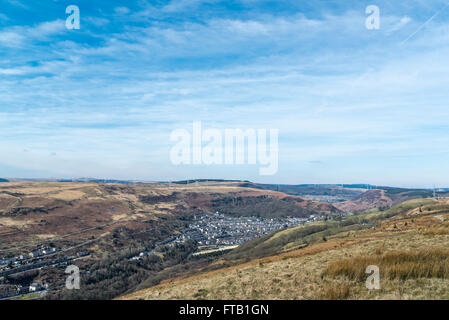 The village of Ferndale from the hills above the valley, and the wind turbines on the opposite hill. Stock Photo