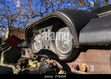 Rusty vintage car cut in half on a sunny day in autumn Stock Photo