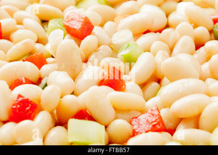 White bean salad with spring onions and red peppers Stock Photo