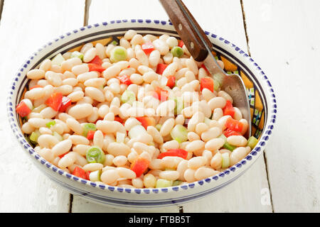 White bean salad with spring onions and red peppers Stock Photo