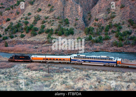 Tourist train runs through the Royal Gorge Route along the Arkansas River, Colorado, USA Stock Photo
