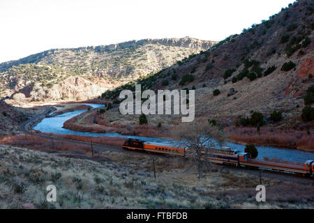 Tourist train runs through the Royal Gorge Route along the Arkansas River, Colorado, USA Stock Photo