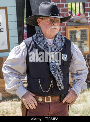 Graeagle, California, USA-  A member of The Nevada Gunfighters Wild West Theatrical Group talks to the audience. Stock Photo