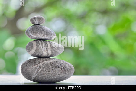 Stack of four stones isolated. stones in balanced pile