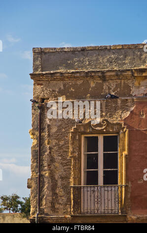 Facade details of very old house at Cagliari downtown, Sardinia Stock Photo