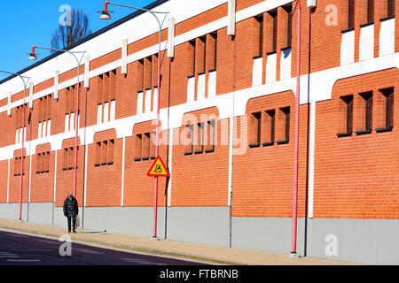 Ahus, Sweden - March 20, 2016: Architectural detail of the Absolut Company factory, the place where Absolut Vodka is made. Red b Stock Photo