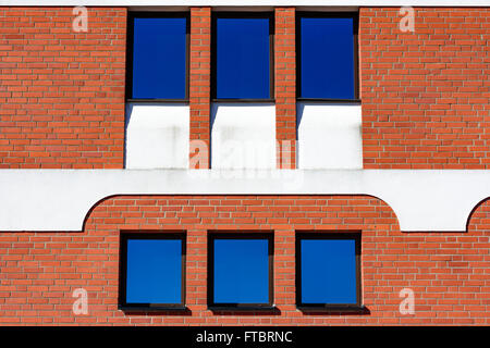 Ahus, Sweden - March 20, 2016: Architectural detail of the Absolut Company factory, the place where Absolut Vodka is made. Red b Stock Photo