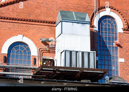 Ahus, Sweden - March 20, 2016: Architectural detail of the Absolut Company factory, the place where Absolut Vodka is made. Red b Stock Photo