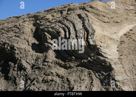 Deformed rock layers in road cut along San Andres fault County of Los Angeles Stock Photo