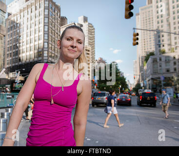 A woman walking down the street in New York city on the upper west side. Stock Photo