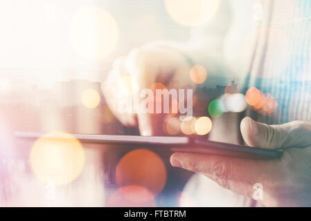 Man using digital tablet computer, casual ordinary adult caucasian man with wireless gadget browsing internet Stock Photo