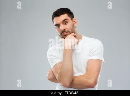 man thinking over gray background Stock Photo