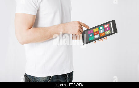 close up of man with app icons on tablet pc Stock Photo
