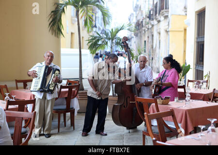 CUBA - September 2011: Havana,Cuban musicians entertaining diners in Old Havana Stock Photo