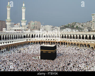 Thousands of Muslim hajj pilgrims circle the Holy Kaaba in the Al-Masjid al Haram in Mecca, al-Hejaz, Saudi Arabia. The kabah is most sacred Muslim site in the world. Stock Photo