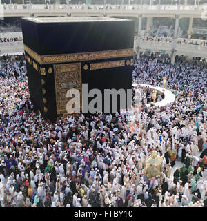 Thousands of Muslim hajj pilgrims circle the Holy Kaaba in the Al-Masjid al-Haram in Mecca, al-Hejaz, Saudi Arabia.  Makkah, Kingdom of Saudi Arabia. The kabah is most sacred Muslim site in the world. Stock Photo