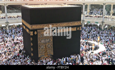 Thousands of Muslim hajj pilgrims circle the Holy Kaaba in the Al-Masjid al-Haram in Mecca, al-Hejaz, Saudi Arabia.  Makkah, Kingdom of Saudi Arabia. The kabah is most sacred Muslim site in the world. Stock Photo