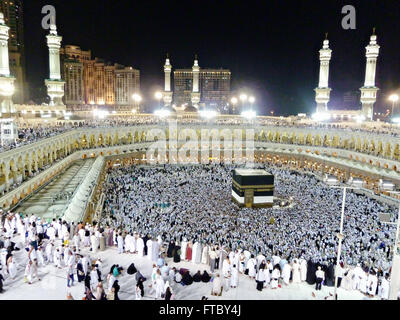 Thousands of Muslim hajj pilgrims circle the Holy Kaaba in the Al-Masjid al Haram in Mecca, al-Hejaz, Saudi Arabia. The kabah is most sacred Muslim site in the world. Stock Photo