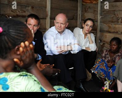 Former United Kingdom Foreign Secretary William Hague and actress and U.N Special Envoy Angelina Jolie Pitt visit the visit Nzolo refugee camp March 24, 2013 in Goma, Democratic Republic of Congo. Stock Photo