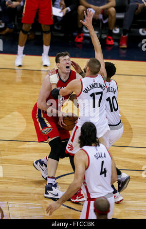 New Orleans, LA, USA. 26th Mar, 2016. New Orleans Pelicans center Omer Asik (3) is fouled by Toronto Raptors guard DeMar DeRozan (10) during an NBA basketball game between the Toronto Raptors and the New Orleans Pelicans at the Smoothie King Center in New Orleans, LA. Stephen Lew/CSM/Alamy Live News Stock Photo