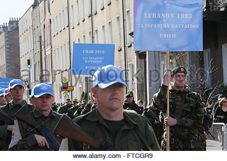 Dublin, Ireland. 27th March, 2016. Members of Irish forces who have served abroad march in the procession in Dublin today as part of the 1916 centenary weekend. Credit:  reallifephotos/Alamy Live News Stock Photo