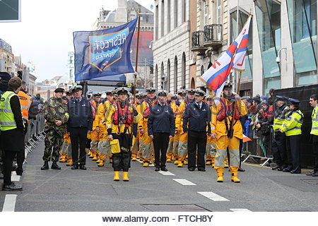 Dublin, Ireland. 27th March, 2016. A group  participating in the Easter parade pauses in Dame Street Dublin before moving on towards O Connell bridge. The Easter 1916 Rising has taken place in a mix of sunshine and showers in the irish capital. Credit:  reallifephotos/Alamy Live News Stock Photo