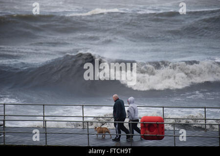 Aberystwyth Wales UK, Easter Sunday,  27 March 2016   UK Weather: Storm Katie brings strong winds and huge waves to batter the seaside at Aberystwyth on  Easter Sunday  The storm is projected to increase in severity, especially along the south facing coasts of England, with winds likely to gust up to 80mph in some places tomorrow    Credit:  keith morris/Alamy Live News Stock Photo