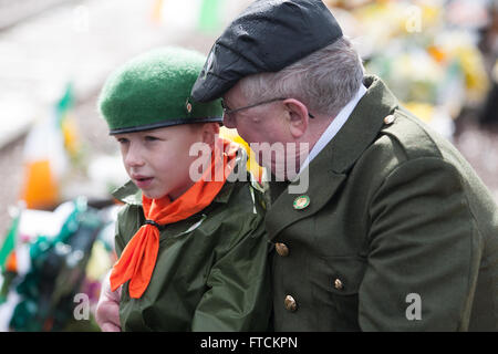 Falls Road, Belfast,UK 27th March 2016 A man puts his arm around his Grandson at the Easter Rising 100th Anniversary  Parade Credit:  Bonzo/Alamy Live News Stock Photo