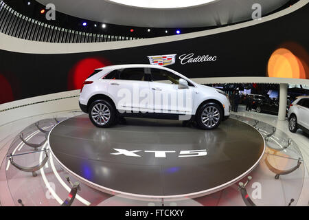 March 23, 2016 - Manhattan, New York, United States - A white 2017 Cadillac XT5 SUV is shown at the New York International Auto Show 2016, at the Jacob Javits Center. This was Press Preview Day one of NYIAS, and the Trade Show will be open to the public for ten days, March 25th through April 3rd. (Credit Image: © Ann Parry via ZUMA Wire) Stock Photo