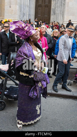 African-American lady wearing traditional dress and head wrap at the 2016 Easter Bonnet parade and festival in New York. Stock Photo