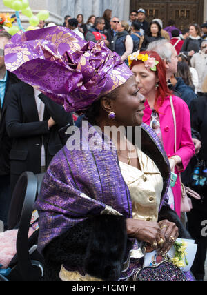 African-American lady wearing traditional dress and head wrap at the 2016 Easter Bonnet parade and festival in New York. Stock Photo