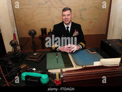 150324-N-BD333-093 PORTSMOUTH, United Kingdom (March 24, 2015) Capt. Daniel Grieco, commanding officer aboard the aircraft carrier USS Theodore Roosevelt (CVN 71) sits in Sir Winston S. Churchill’s chair in his office-bedroom during a tour of the Churchill War Rooms museum in London, March 24, 2015. Theodore Roosevelt Carrier Strike Group (TRCSG) leadership, including Cdr. Christine O'Connell, commanding officer of the Arleigh-Burke class guided missile destroyer USS Winston S. Churchill (DDG 81), attended the tour of the museum. Churchill, home-ported in Norfolk, is conducting naval operation Stock Photo