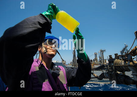 150513-N-FQ994-270 MEDITERRANEAN SEA (May 13, 2015) Gas Turbine Systems Technician (Mechanical) 3rd Class Landon Scobey, from Los Angeles, conducts a clear-and-bright fuel test aboard USS Ross (DDG 71) during a replenishment-at-sea with USNS John Lenthall (T-AO 189) May 13, 2015. Ross, an Arleigh Burke-class guided-missile destroyer, forward-deployed to Rota, Spain, is conducting naval operations in the U.S. 6th Fleet area of operations in support of U.S. national security interests in Europe. (U.S. Navy photo by Mass Communication Specialist 3rd Class Robert S. Price/Released) Stock Photo