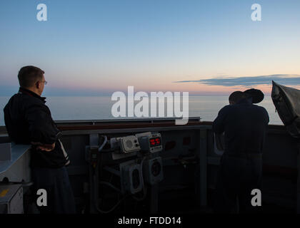 150601-N-FQ994-002 BLACK SEA (June 1, 2015) Yeoman 2nd Class Eric Phannstiel, from College Station, Texas, left, and Operations Specialist 2nd Class Gerardo Hernandez, from San Antonio, Texas, monitor a surface contact while aboard USS Ross (DDG 71) as the ship transits the Black Sea June 1, 2015. Ross, an Arleigh Burke-class guided-missile destroyer, forward-deployed to Rota, Spain, is conducting naval operations in the U.S. 6th Fleet area of operations in support of U.S. national security interests in Europe. (U.S. Navy photo by Mass Communication Specialist 3rd Class Robert S. Price/Release Stock Photo