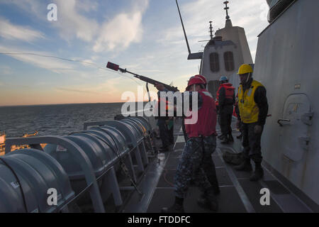 150610-N-HX127-028  Baltic Sea (June 10, 2015) -- US Navy Sailors prepare to fire shot lines in preparation for a refueling at sea aboard the amphibious transport dock ship USS San Antonio (LPD 17) during BALTOPS 2015. BALTOPS is an annual multinational exercise designed to enhance flexibility and interoperability, as well as demonstrate resolve among allied and partner forces to defend the Baltic region. (U.S. Navy photo by Mass Communications Specialist 3rd Class Timothy M. Ahearn/Released) Stock Photo