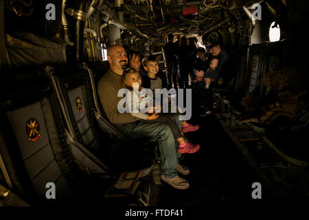 150725-M-JT438-108 NAIROBI, Kenya (July 25, 2015) Personnel and families from the U.S. Embassy in Nairobi tour an MV-22B Osprey during President Barack Obama’s visit to Kenya July 25, 2015. Elements of the 15th Marine Expeditionary Unit, based out of Camp Pendleton, California, and embarked aboard the USS Essex, are conducting naval operations in the 6th Fleet areas of operation in support of U.S. national security interests in Europe and Africa. (U.S. Marine Corps photo by Cpl. Elize McKelvey/Released) Stock Photo
