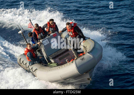 151006-N-TC720-204 MEDITERRANEAN SEA (Oct. 6, 2015) Sailors assigned to USS Donald Cook (DDG 75) return to the ship after conducting a personnel transfer Oct. 6, 2015. Donald Cook, an Arleigh Burke-class guided-missile destroyer, forward deployed to Rota, Spain is conducting a routine patrol in the U.S. 6th Fleet area of operations in support of U.S. national security interests in Europe. (U.S. Navy photo by Mass Communication Specialist 3rd Class Mat Murch/Released) Stock Photo