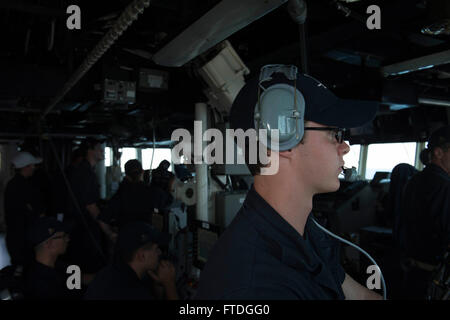 151016-N-TC720-155 LARNACA, Cyprus  (Oct. 16, 2015) Operations Specialist Seaman Ryan Cornell, from Kansas City, Missouri, relays information from the plotting officer  to the bridge aboard USS Donald Cook (DDG 75) as the ship gets underway from Larnaca, Cyprus, Oct. 16, 2015. Donald Cook, an Arleigh Burke-class guided-missile destroyer, forward deployed to Rota, Spain is conducting a routine patrol in the U.S. 6th Fleet area of operations in support of U.S. national security interests in Europe. (U.S. Navy photo by Mass Communication Specialist 3rd Class Mat Murch/Released) Stock Photo