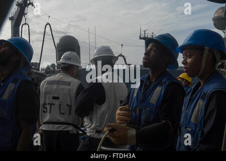 151023-N-TC720-288 MEDITERRANEAN SEA (Oct. 23, 2015) Seaman Maurice Walls, from Columbus, Ohio, operates a sliding padeye aboard USS Donald Cook (DDG 75) during a replenishment at sea with the Military Sealift Command fleet replenishment oiler USNS Leroy Grumman (T-AO-195) Oct. 23, 2015. Donald Cook, an Arleigh Burke-class guided-missile destroyer, forward deployed to Rota, Spain is conducting a routine patrol in the U.S. 6th Fleet area of operations in support of U.S. national security interests in Europe. (U.S. Navy photo by Mass Communication Specialist 3rd Class Mat Murch/Released) Stock Photo