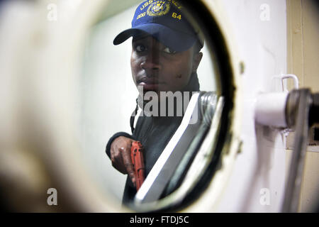 151125-N-FP878-029 MEDITERRANEAN SEA (Nov. 24, 2015) Boatswain’s Mate 3rd Class Luis Dicent, from Newark, New Jersey, participates in a force protection drill aboard USS Carney (DDG 64) Nov. 24, 2015. Carney, an Arleigh Burke-class guided-missile destroyer, forward deployed to Rota, Spain, is conducting a routine patrol in the U. S. 6th Fleet area of operations in support of U.S. national security interests in Europe. (U.S. Navy photo by Mass Communication Specialist 1st Class Theron J. Godbold/Released) Stock Photo