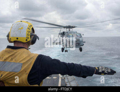 151203-N-AO823-076 MEDITERRANEAN SEA (Dec. 3, 2015) Boatswain's Mate 3rd Class D. Kostenbauder signals an MH-60R Sea Hawk helicopter during a helicopter in-flight refueling above guided-missile destroyer USS Bulkeley (DDG 84). Bulkeley, part of the Harry S. Truman Carrier Strike Group, is conducting naval operations in the U.S. 6th Fleet area of operations in support of U.S. national security interests in Europe and Africa. (U.S. Navy photo by Mass Communication Specialist 2nd Class M. J. Lieberknecht/Released) Stock Photo